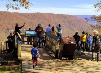 Sightseers gather at the New River Gorge overlook at Grandview.