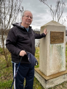 Terry Lowry stands alongside a marker raised in memory of the Battle of Scary Creek.