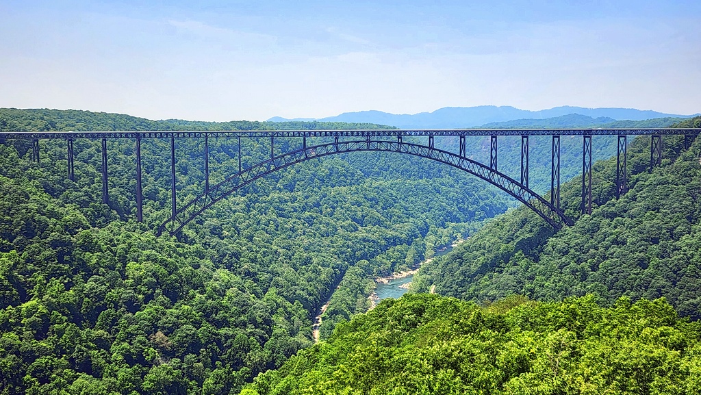 The New River Gorge Bridge arches across the gorge, as seen from Long Point. 