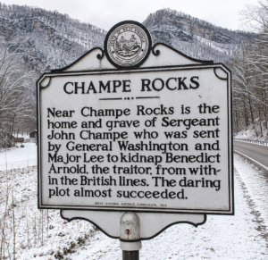 A West Virginia historical marker near Champe Rocks recounts the story of Sgt. Maj. John Champe, the Revolutionary War soldier selected by George Washington for a secret mission to kidnap Benedict Arnold. The towering sandstone formation in Hardy County bears Champe's name. (WVExplorer photo)