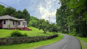 A well-tended country road leads up Barkers Creek past the McKinney Homeplace and into the mountains.