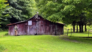 An old barn slouches in the barnyard beside the McKinney Homestead.