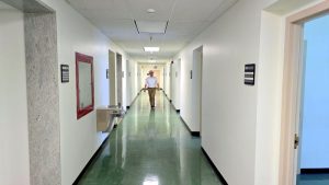 Commercial Real Estate: Broad hallways extend through the 65-office room main building.