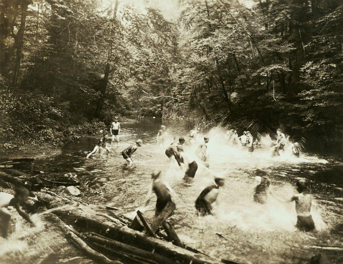 Before air conditioning became widespread, families across West Virginia escaped oppressive summer heat by gathering at cool mountain streams, a tradition that reached its peak during the record-breaking heat waves of the early 1900s and Dust Bowl era.