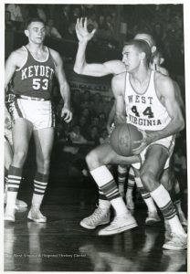 Basketball in West Virginia — Another high school-era snapshot: Jerry West in mid-air during a game, highlighting his signature athleticism even as a young player in East Bank. 
