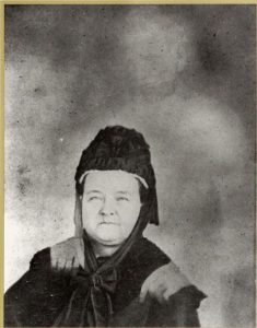 A 1857 "ghost photograph" depicts a spirit posing behind the sitter.