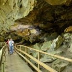 Hikers walk the boardwalk on the Alum Cave Trail at Audra State Park.