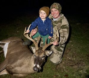 Emma Malcomb, of Tallmansville, W.Va., poses with a big buck.