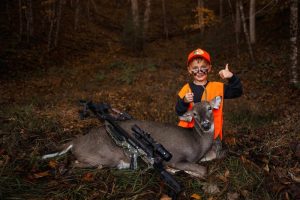 Judah Brooks, of Cool Ridge, W.Va., poses with a trophy buck.