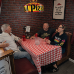 Appalachian Escapes: Straight out of the ’80s: David Sibray, Nate Adams, and Rachel Adkins swap stories in a replica Pizza Hut. (Photo: Holly K. Clark)