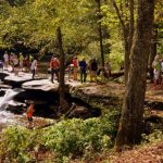 Hikers visit falls at Beckley Mill, Beckley, Raleigh County