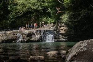 Swimmers cool off in a popular swimming hole along Glade Creek in Raleigh County, where cold mountain streams offer welcome relief during West Virginia's hottest summer days. (Photo by Jay Young, IronArchMedia.com)