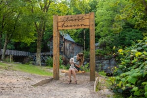 A visitor and her pouch swing at Babcock State Park.