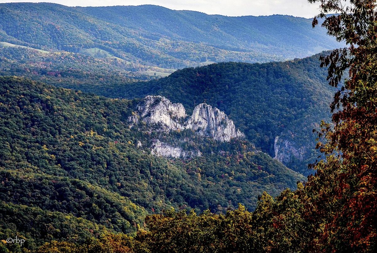 The peaks of North Fork Mountain rise behind Seneca Rocks.