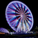 The 230-foot America250 Wheel rises above the West Virginia State Capitol Complex in Charleston during the state's official America250 Capital City Celebration. The observation wheel offers panoramic views of the capital city and is among the event's signature attractions. (Courtesy W.Va. Tourism)