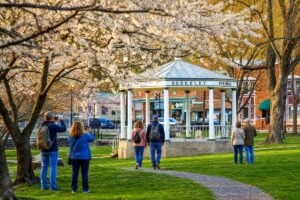 Visitors gather around the historic bandstand in Berkeley Springs State Park, where many first-time travelers discover that the town's official name is actually Bath, a distinction that has endured since 1776. (WVExplorer photo)