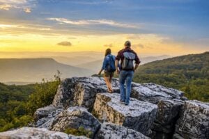 A young couple hikes to an overlook in the Dolly Sods Wilderness, where elevations above 4,000 feet and expansive mountain vistas make the high country a refreshing escape during the Fourth of July holiday. (Photo: WV Tourism)
