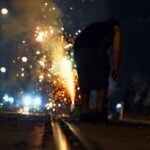 A spectator watches a Fourth of July fireworks display. Medical professionals say hand injuries and burns increase significantly during Independence Day celebrations each year. (Photo: Dillen M)