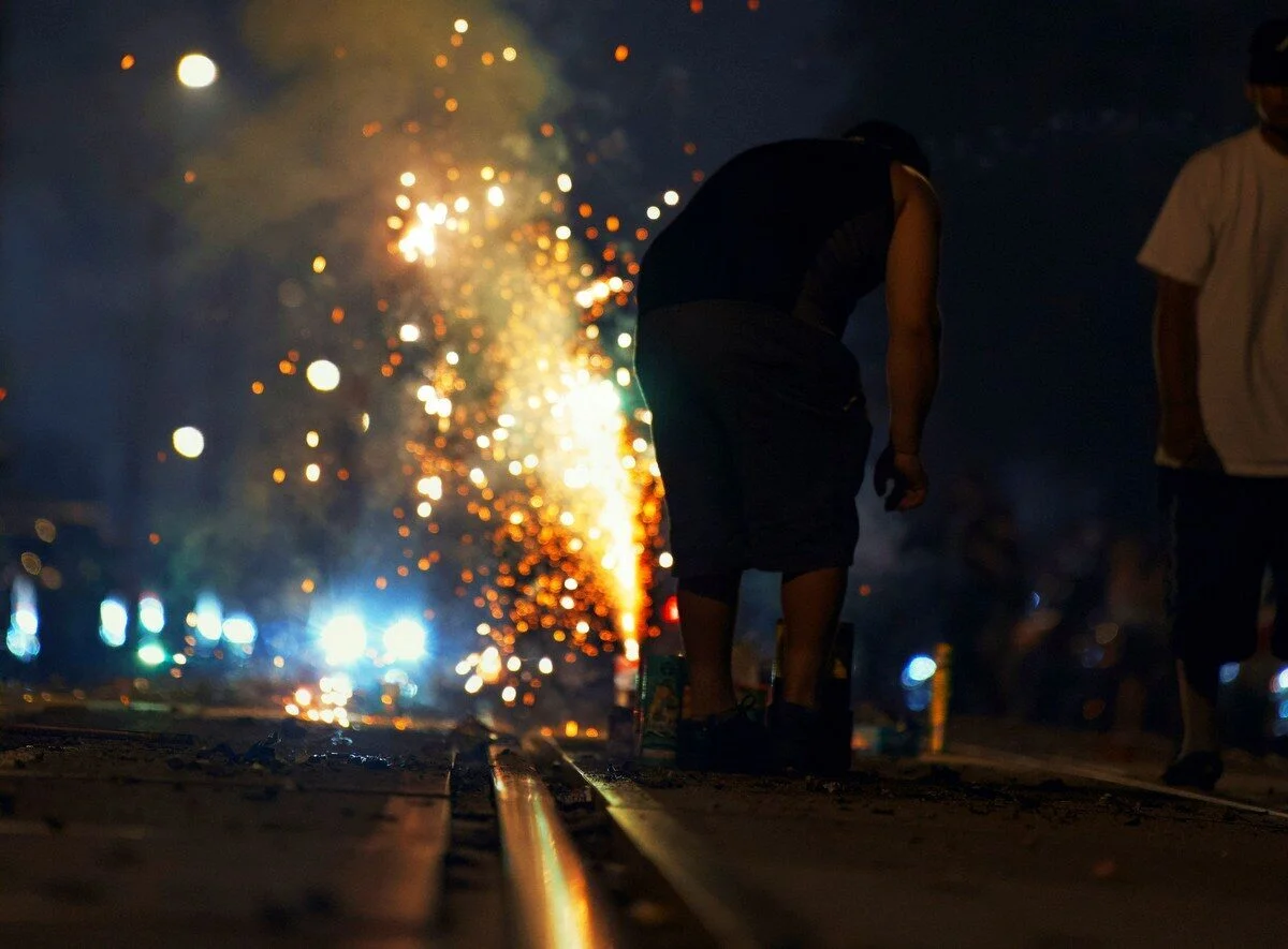 A spectator watches a Fourth of July fireworks display. Medical professionals say hand injuries and burns increase significantly during Independence Day celebrations each year. (Photo: Dillen M)