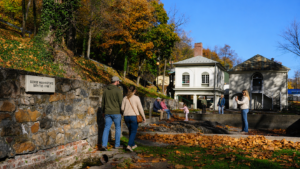 Visitors explore the historic mineral bath area at Berkeley Springs State Park, home to the famous George Washington's Bathtub. The warm mineral springs inspired the founding of the Town of Bath in 1776 and continue to draw visitors nearly 250 years later. (WVExplorer photo)