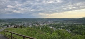 As they appear today from the Grand Vue overlook, the Grave Creek Flats fill the broad valley of the Ohio River at Moundsville, West Virginia.