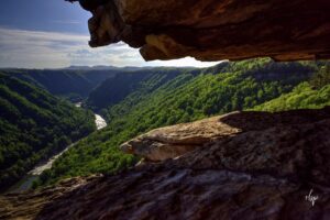 Hiking in West Virginia: The Endless Wall Trail follows the rim of the New River Gorge in the distance as seen from the Beauty Mountain cliffs.