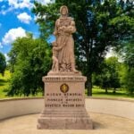The Madonna of the Trail stands beside the historic National Road in Wheeling, honoring the pioneer women whose strength and sacrifice helped open the American frontier. The 1928 monument is one of only 12 identical statues erected across the United States. (Photo: David Sibray / WVExplorer)