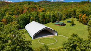 The equestrian complex at the historic Pence Springs resort includes a covered arena, riding facilities, and open pastureland. The property will host horse show events associated with Alderson's Fourth of July celebration.
