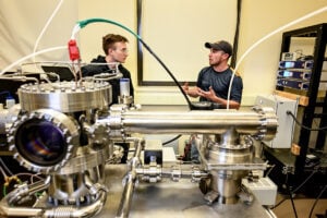Thomas Steinberger, right, works with undergraduate student Alexander Bailey in a West Virginia University plasma laboratory. The team is developing new laser-based techniques that could improve technologies used in computer chip manufacturing, spacecraft propulsion and future fusion-energy systems. (WVU Photograph/Jennifer Shephard)