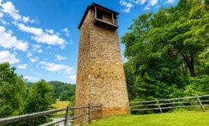 The Jackson Ferry Shot Tower on the New River is a familar monument on I-77 near Fort Chiswell. (WVExplorer Illustration)