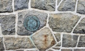 The rugged stone pedestal supporting Wheeling's Mingo Statue was designed to complement the monument's hilltop setting overlooking the Ohio Valley. The landmark has greeted travelers entering Wheeling for nearly a century.