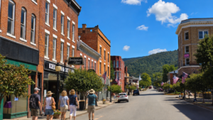 Visitors explore the historic downtown of Hinton, a gateway to the southern reaches of New River Gorge National Park and Preserve, where brick-lined streets, local shops, and mountain scenery offer a quieter side of the park experience. (Photo: David Sibray / WVExplorer)