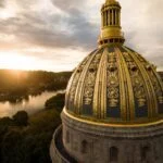 The gold dome of the West Virginia State Capitol rises above Charleston. West Virginia celebrates its 163rd birthday on June 20, commemorating its admission to the Union in 1863 during the Civil War.