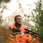 A hunter walks through a forest during West Virginia's fall hunting season. The state has released updated hunting and trapping regulations for the 2026-27 seasons, including changes affecting deer, bear and turkey hunters. (Photo courtesy W.Va. Dept. of Commerce)