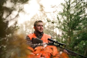 A hunter walks through a forest during West Virginia's fall hunting season. The state has released updated hunting and trapping regulations for the 2026-27 seasons, including changes affecting deer, bear and turkey hunters. (Photo courtesy W.Va. Dept. of Commerce)