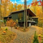 Rather than leveling the land, this contemporary West Virginia home in the Canaan Valley embraces the natural mountainside, illustrating how architects increasingly design with the state's steep terrain instead of trying to overcome it. (Illustration courtesy Mills Group)