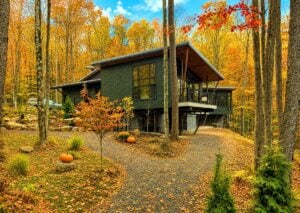 Rather than leveling the land, this contemporary West Virginia home in the Canaan Valley embraces the natural mountainside, illustrating how architects increasingly design with the state's steep terrain instead of trying to overcome it. (Illustration courtesy Mills Group)