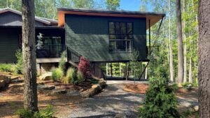 Slopes that might discourage conventional construction often become an asset in mountain home design, offering privacy, dramatic views, and a closer connection to West Virginia's forests. (Courtesy Mills Group)
