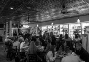 Guests dine at Charleston's 1010 Bridge, where Chef Paul Smith has earned national recognition while showcasing Appalachian ingredients through fine dining.