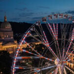 The 230-foot America250 Wheel, billed as the world's tallest portable Ferris wheel, towers above the West Virginia State Capitol during preparations for the state's America250 Capital City Celebration in Charleston. (Photo: W.Va. Tourism)