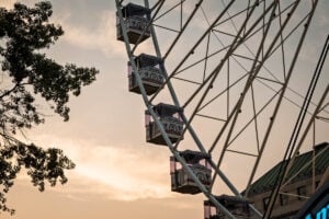 The America250 Wheel glows against a summer sunset over Charleston, offering riders panoramic views from 230 feet above the West Virginia Capitol grounds during the state's America250 celebration. (Photo: W.Va. Tourism)
