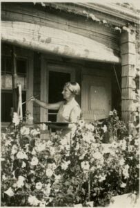 Blanche Lazzell paints outside her waterfront studio in Provincetown, Massachusetts, during the 1930s. The West Virginia University alum helped pioneer the Provincetown white-line woodcut technique and became one of America's earliest modernist printmakers. (West Virginia and Regional History Center Photo)