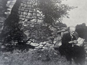 The great great grandson of Peter Tarr visits the furnace before it was restored. (Photo reprinted from West Virginia History textbook, Conely and Doherty, 1974)