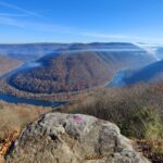 Smoke gathers above the New River Gorge National Park and Preserve during a wildfire. Researchers at West Virginia University are developing an artificial intelligence system that could help satellites detect and track wildfires more quickly across rugged, heavily forested landscapes.