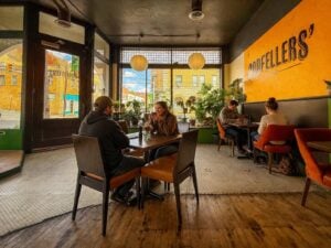 Diners gather inside Oddfellers in downtown Richwood, where locally sourced Appalachian ingredients and from-scratch cooking have helped make the restaurant a destination for visitors exploring the surrounding mountains, trout streams, and hiking trails.
