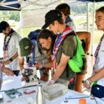 Excitement builds as Scouts check in for Scouting America's National Jamboree at the Summit Bechtel Reserve in southern West Virginia. The 10-day event introduces thousands of young people and their families to the Mountain State through outdoor adventure, leadership, and service.