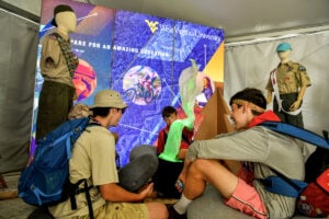 Scouts prepare to head into the mountains during Scouting America's National Jamboree at the Summit Bechtel Reserve in southern West Virginia. For many participants, the event provides a first experience exploring the forests, trails, and outdoor adventures of the New River Gorge region.