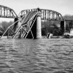 The collapsed Silver Bridge lies submerged in the Ohio River after its catastrophic failure on Dec. 15, 1967. Although not the deadliest disaster in West Virginia history, the collapse claimed 46 lives and transformed bridge inspection standards across the United States.