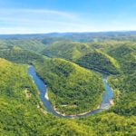 Viewed from above, Stretcher Neck forms one of the most dramatic landforms in the New River Gorge. Much of the surrounding landscape has been acquired by the Arc of Appalachia, protecting nearly 2,000 acres adjoining New River Gorge National Park and Preserve while helping pave the way for a future trail connection between Beckley and the park. (Photo: Lori Herrald Lebl)