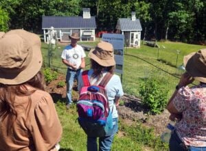 Todd McCree of Great Escape Farms speaks with visitors during a farming workshop at his educational nursery near Romney, W.Va. McCree will present programs on pawpaws and native edible plants during the West Virginia Pawpaw Festival.